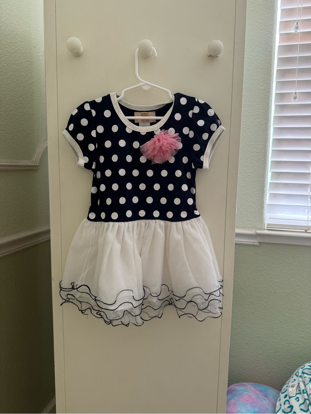 Navy Polka Dot Girls Dress with White Tulle Skirt and Pink Flower